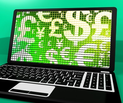 Currency Symbols On Laptop Screen Showing Exchange Rate And Finance