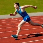 Young Caucasian Athlete Sprinting On Track