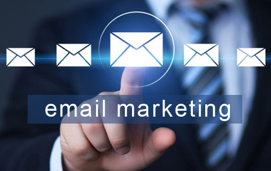 "email marketing" words with hand pointing on envelope