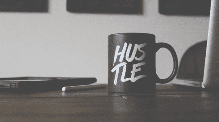 hustle written on a cup