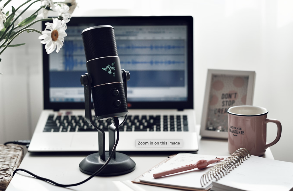 microphone on a desk with a laptop