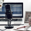 microphone on a desk with a laptop