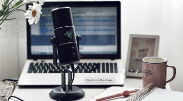 microphone on a desk with a laptop