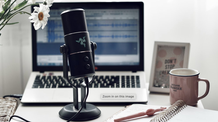 microphone on a desk with a laptop