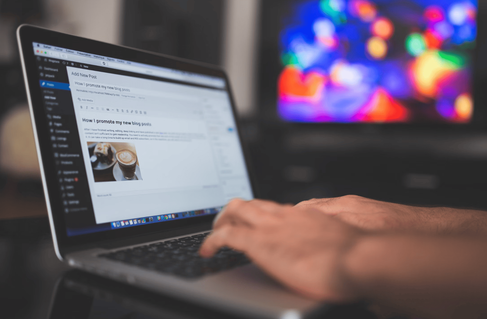 creating a blog post with a laptop on a desk